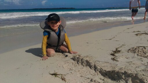 Eli is making a very complex sand construction.